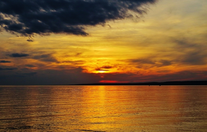 Dark cloud takes on beautiful sunset. North Bay, Ontario Canada