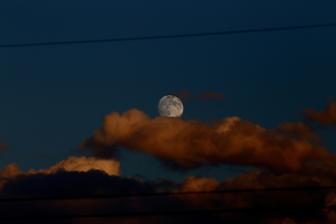 Cloudy almost full Moon Calgary, Alberta Canada