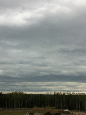 layers of rain clouds Fort McMurray, Alberta Canada