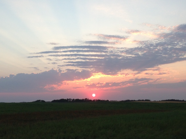 sun setting Springside, Saskatchewan Canada