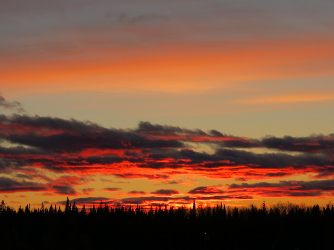 sun setting Fort Mackay, Alberta Canada