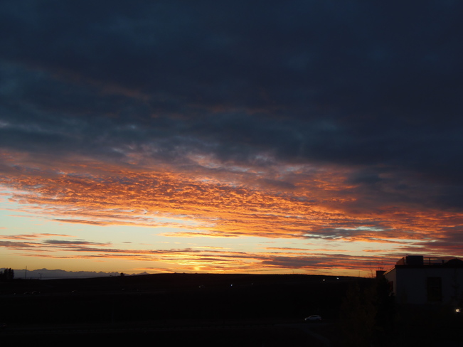 Sun sets closing a wonderful day at Rocky Ridge Calgary, Alberta Canada