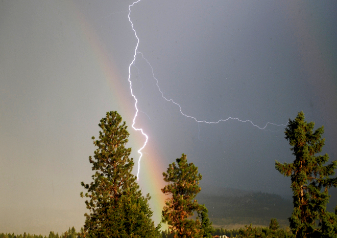 Lightning through a rainbow South Kelowna, British Columbia Canada