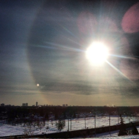 under frozen skies sun dogs fly Winnipeg, Manitoba Canada