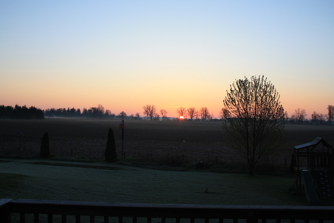Sun rise over the farm field Nilestown, ON