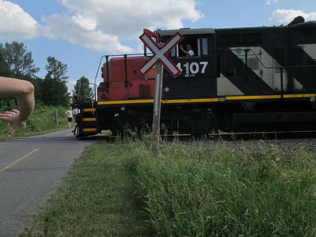 Train Rumbles Over Bicycle Trail in Greenbelt near Kanata in Ottawa Watts Creek Pathway, Nepean, ON K2K 2Y5, Canada