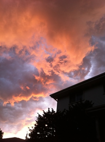 Setting sun vs storm clouds Kingston, Ontario Canada
