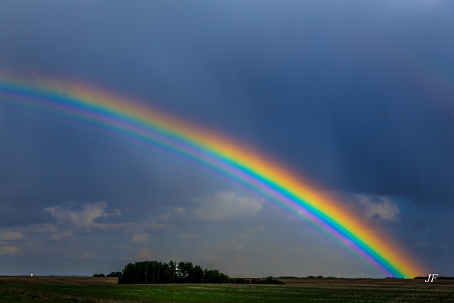 Rainbow after a light shower. Unity, Saskatchewan