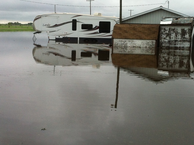 Neighbors' under water. Reston, Manitoba Canada