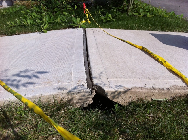 It was so hot that the 3 year-old sidewalk lifted off the ground. Milton, Ontario Canada