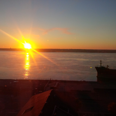 The sun rising over the St-Lawrence River Trois-Rivières, Quebec Canada