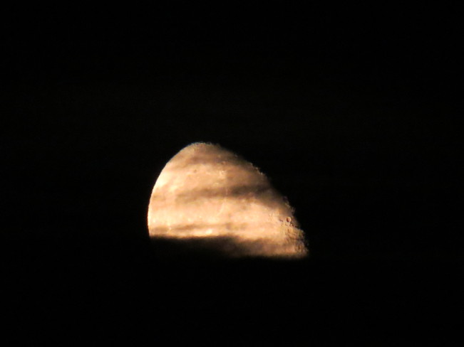 Moon rise threw the clouds Edmonton, Alberta Canada