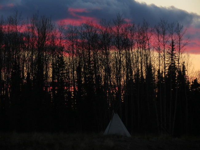 sun setting 6pm Fort Mackay, Alberta Canada