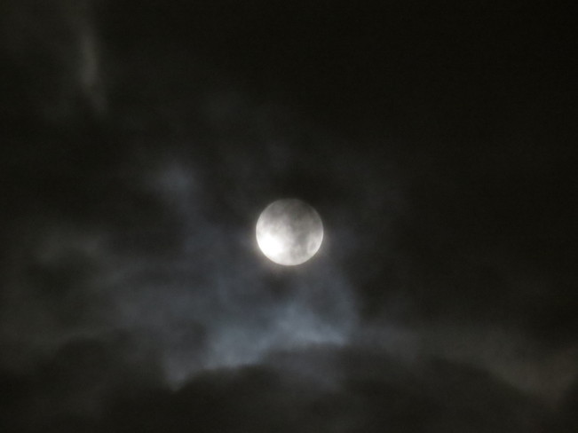 moon in the clouds Edmonton, Alberta Canada