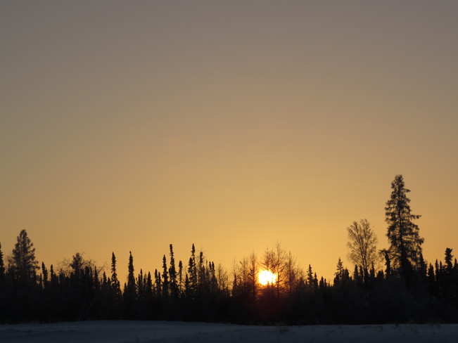 sun setting on a cold day Fort Mackay, Alberta Canada