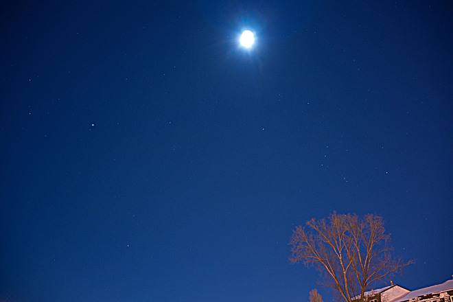 Moon, with Jupiter (brightest light on left), 