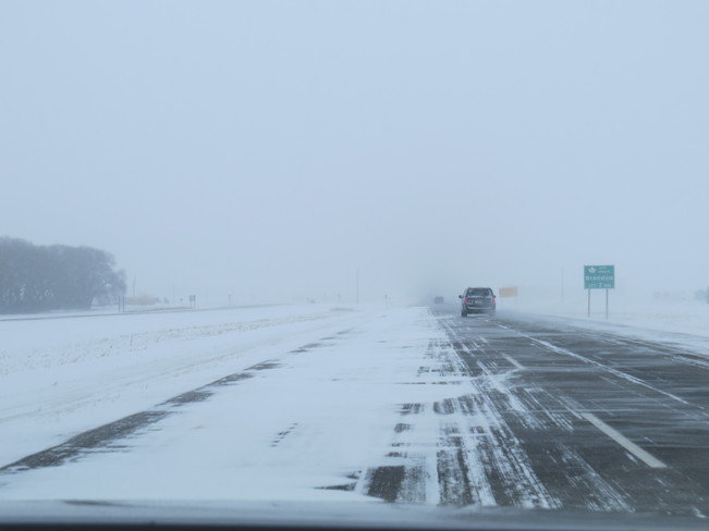 drifting snow on highway Brandon, Manitoba Canada