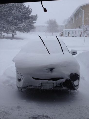 Car covered in snow Owen Sound, Ontario Canada