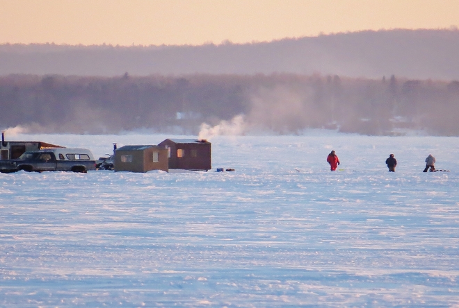 Only the brave fishing outside the hut. North Bay, Ontario Canada