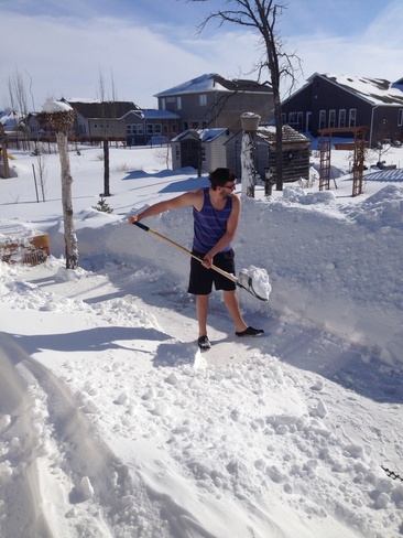 manitoban shoveling at -2 C La Salle, Manitoba Canada