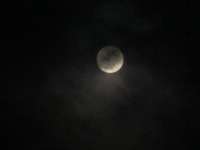 Full Moon hiding in the clouds Vernon, British Columbia Canada