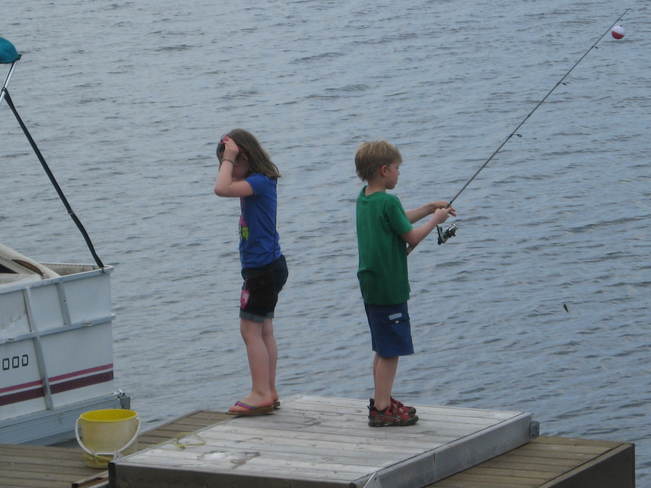 2 Friends Fishing Off The Dock at Mawn Lake Thunder Bay, ON