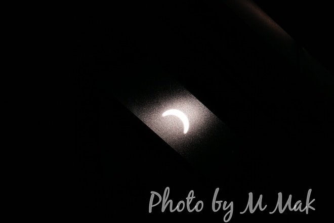 Solar eclipse from glass reflection Richmond, BC