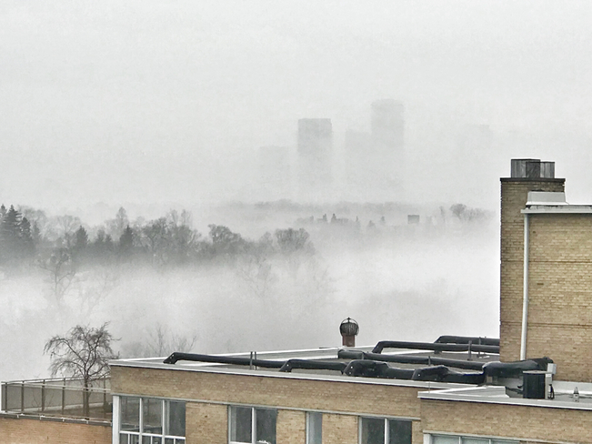 Fog enshrouds Toronto skyline Etobicoke, Ontario, CA