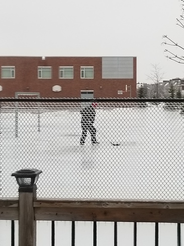 Playing hockey on schoolyard soccer field Brooklin, ON