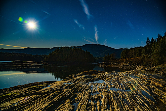 Clear skyâ€™s under a full super moon on the ocean Prince Rupert, British Columbia, CA