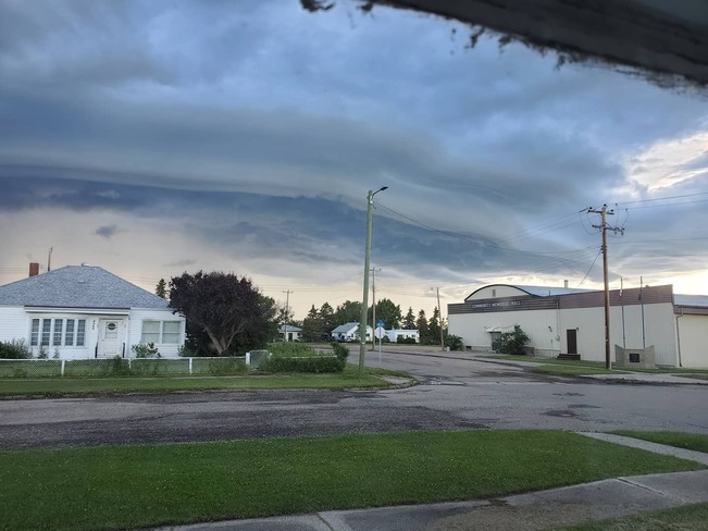 Shelf cloud hanging over small town Rycroft, AB
