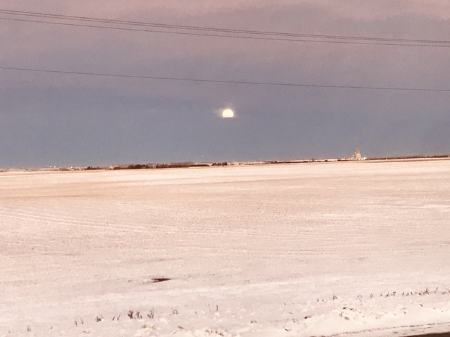 Moon setting down Regina, Saskatchewan, CA