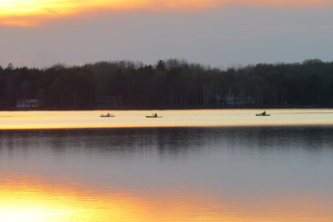 Sunset and Boaters. Conquerall Mills, Nova Scotia