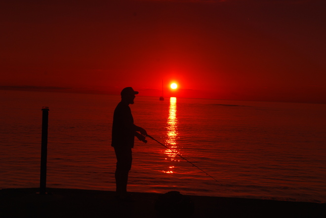 Setting sun & fisherman Kincardine, ON