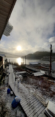 sun,snow,rain on a calm winter day Hartley Bay, BC
