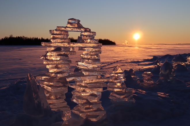 Sunset and Ice Inukshuks at Silver Harbour Conservation Area Thunder Bay, Ontario, CA