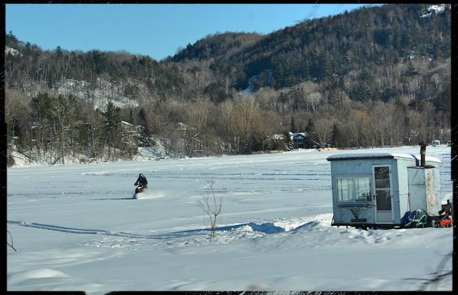 Winter ice fishing on a lake Saint-Pierre-de-Wakefield, QC