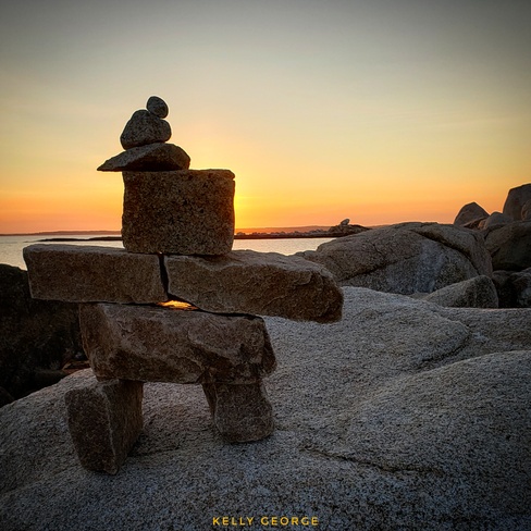 inukshuk watching the sunset Peggys Cove, NS