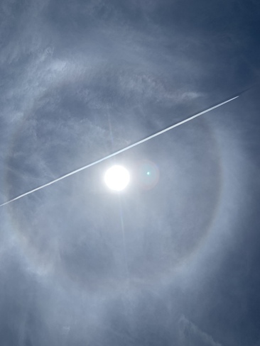 halo around sun & Airplane jet stream appears to be passing through halo. 1012 Tiny Beaches Road South, Tiny, ON