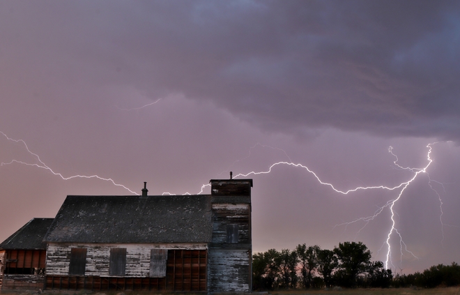 lightning by abandoned church Brooks, AB