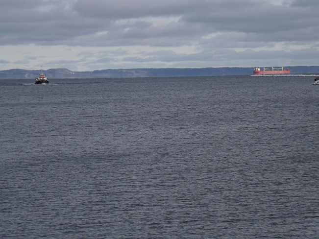 SHIP LEAVING and a TUG coming INTO PORT Thunder Bay, ON
