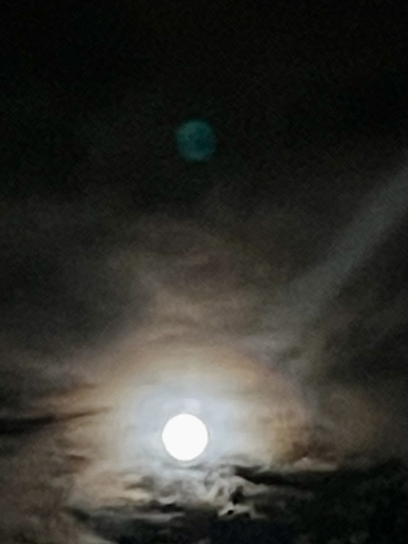 Full moon with unknown planet behind it Sicamous, British Columbia, CA